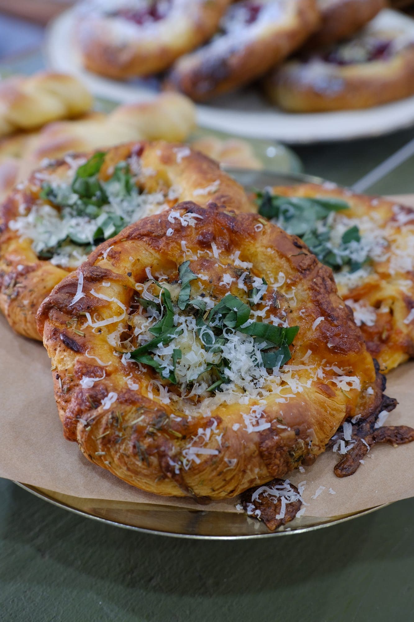 A savoury danish scattered with herbs