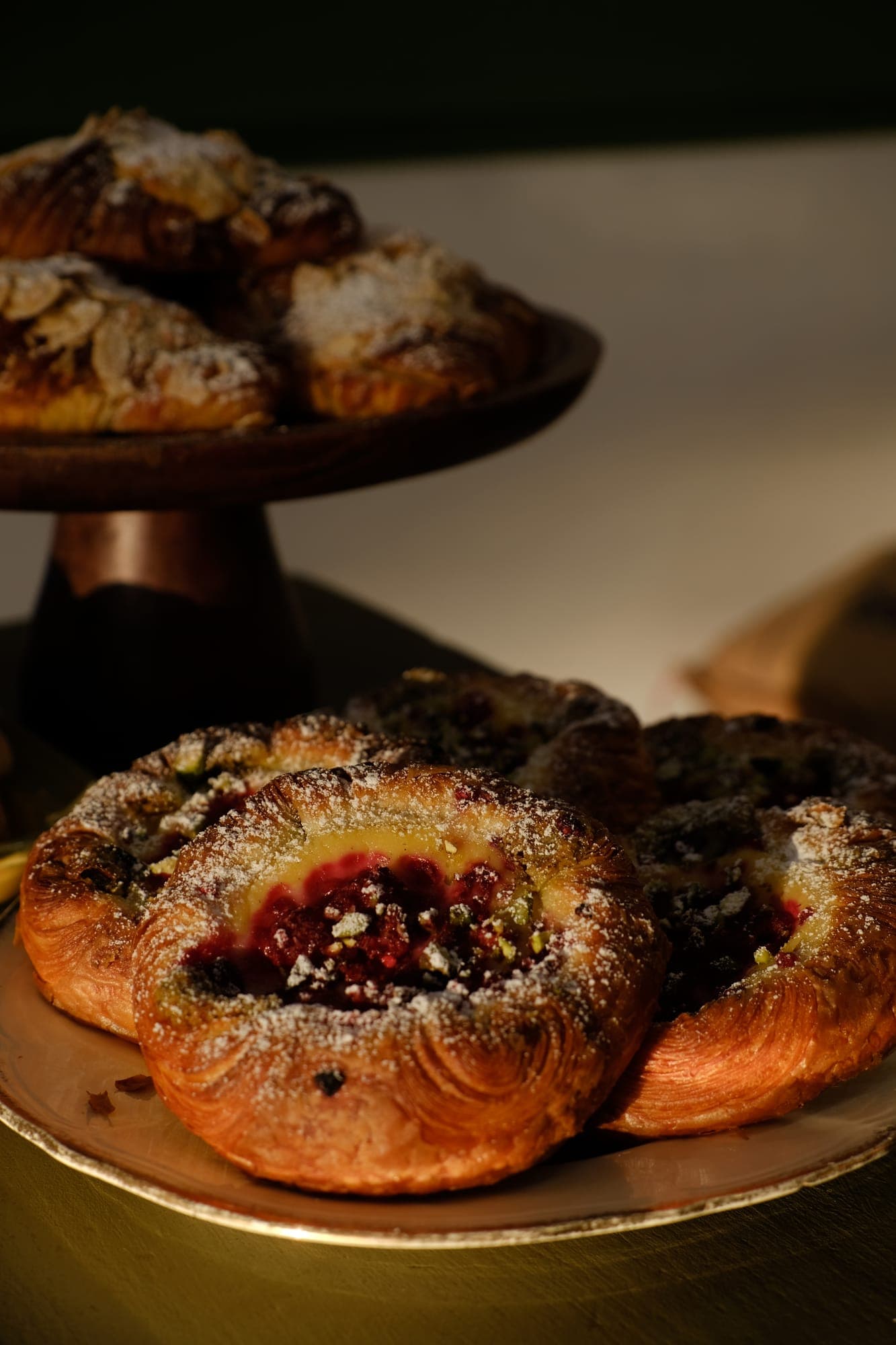 Cardamom buns piled on a cake stand